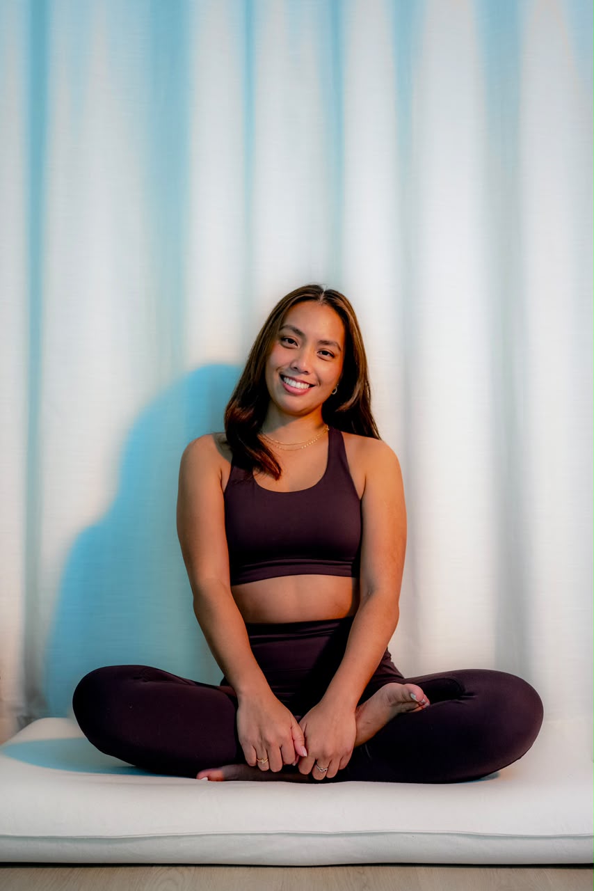 Alyson Faith Fajardo smiling warmly - Yoga & Pilates Instructor