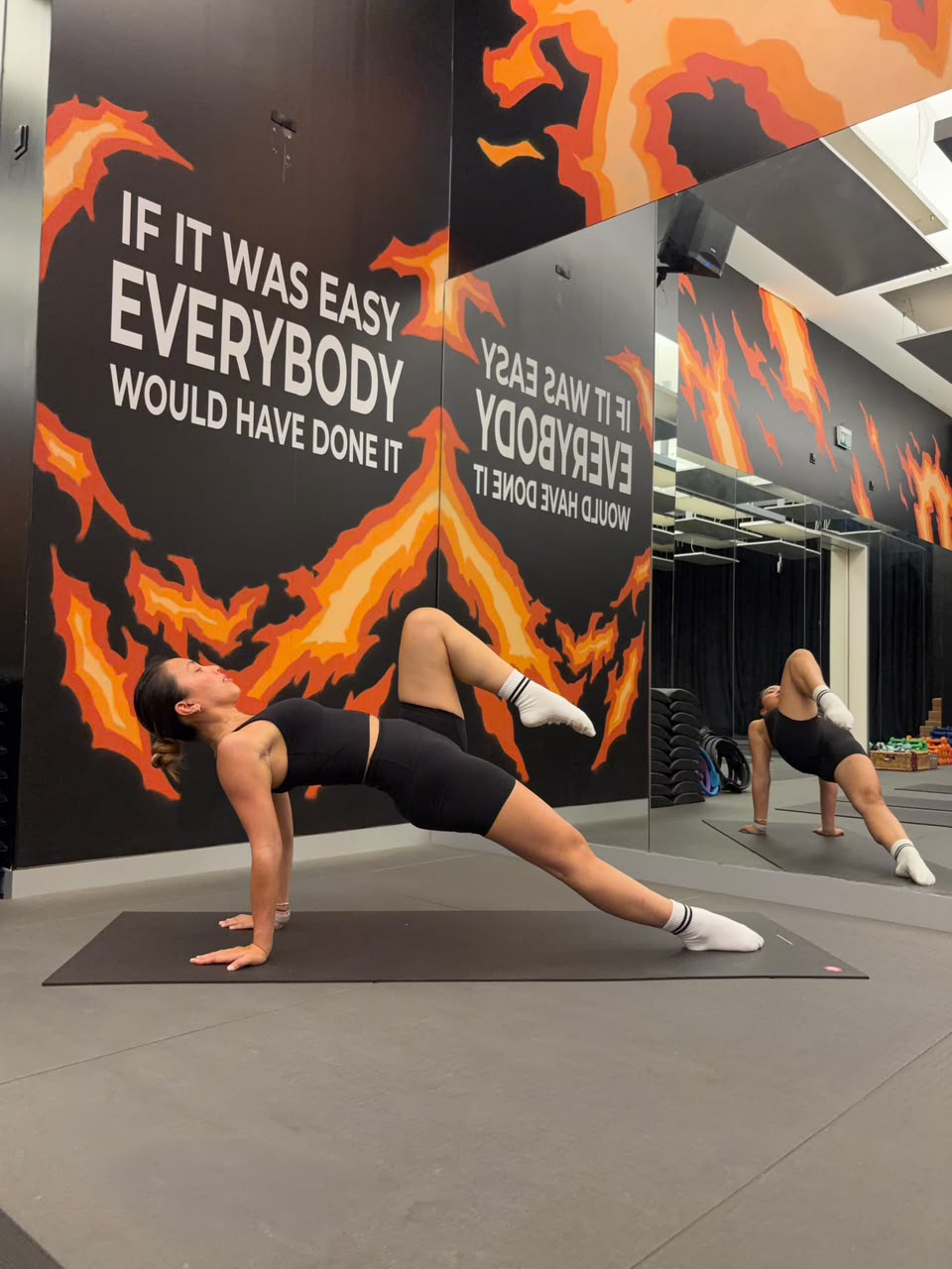 Alyson Fajardo on the Pilates reformer apparatus